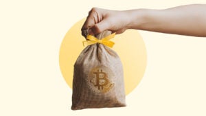 hand passing bag of bitcoin